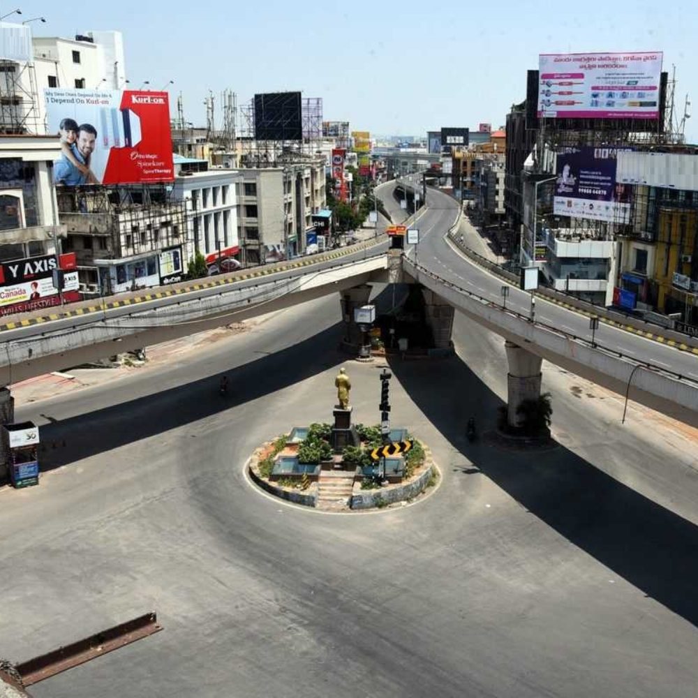 Professional website displayed on a laptop with Punjagutta Flyover and Metro Station in the background.